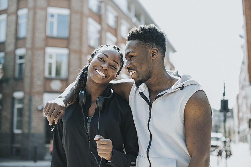 Young couple walking down the street together